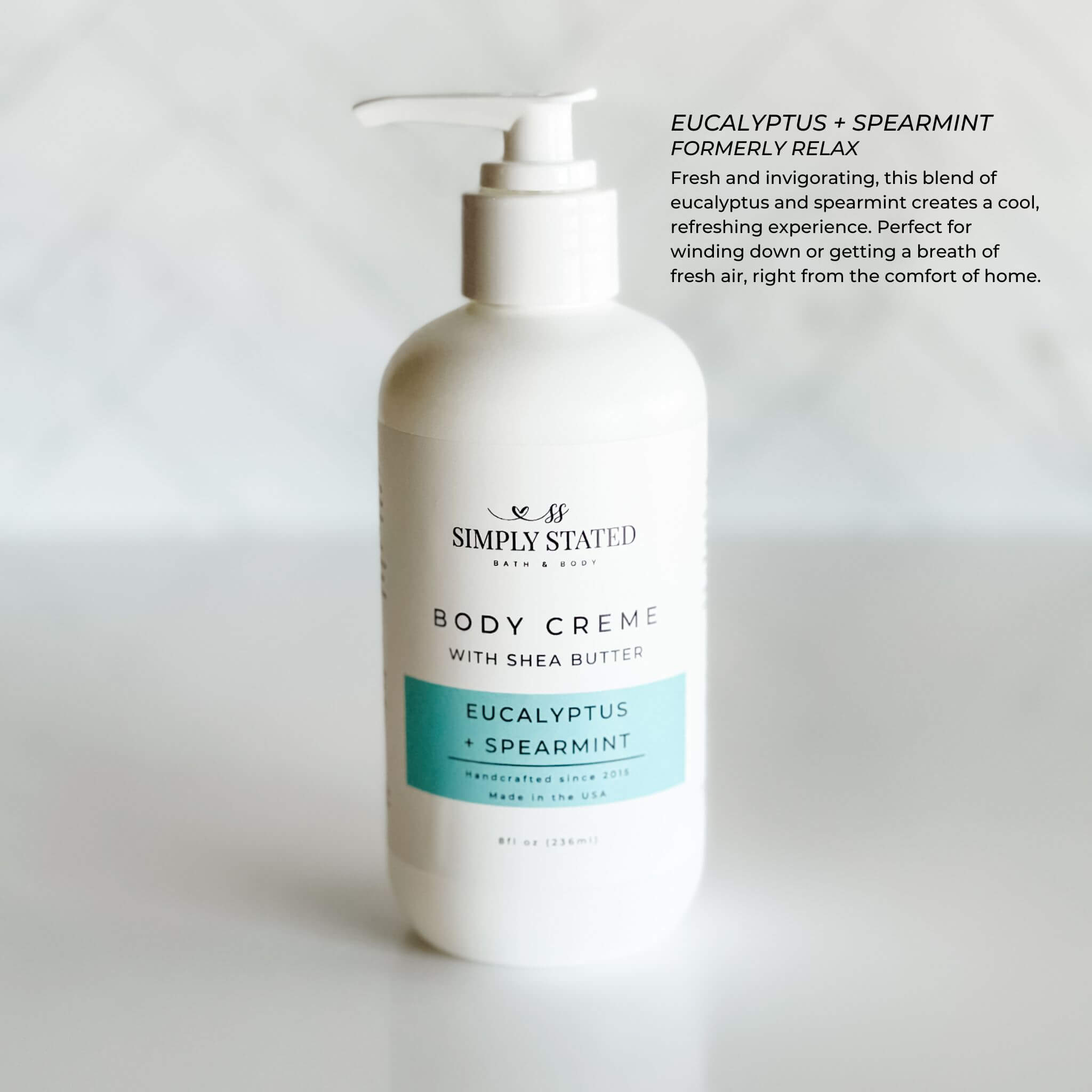 Simply Stated Bath & Body 8oz Aromatherapy Body Creme in Eucalyptus + Spearmint with new pump packaging. Fresh and invigorating, this creme offers a cool, refreshing experience for relaxation or a revitalizing moment.