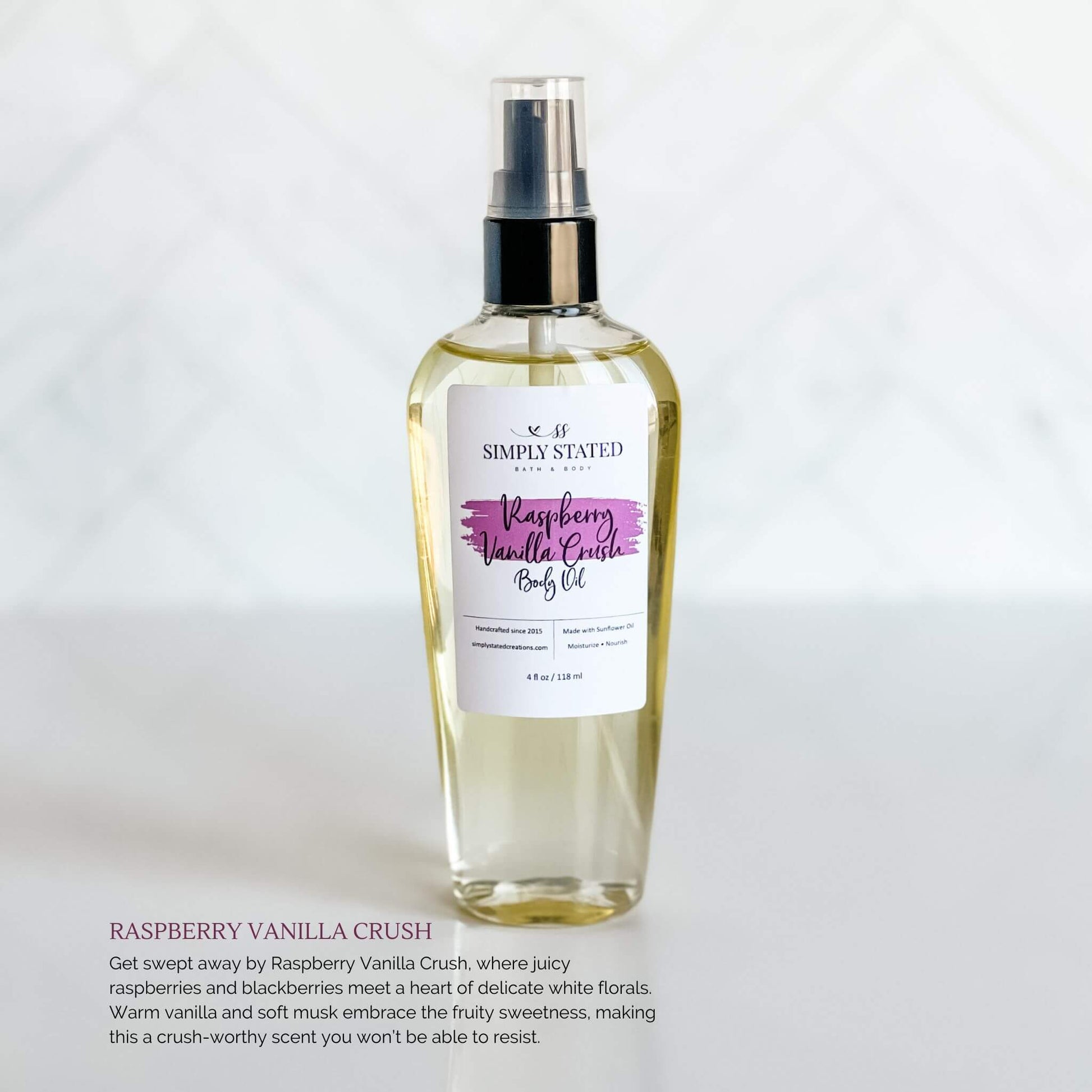 Simply Stated Bath & Body Raspberry Vanilla Crush Body Oil in a glass spray bottle, featuring a light purple label, displayed on a white background.