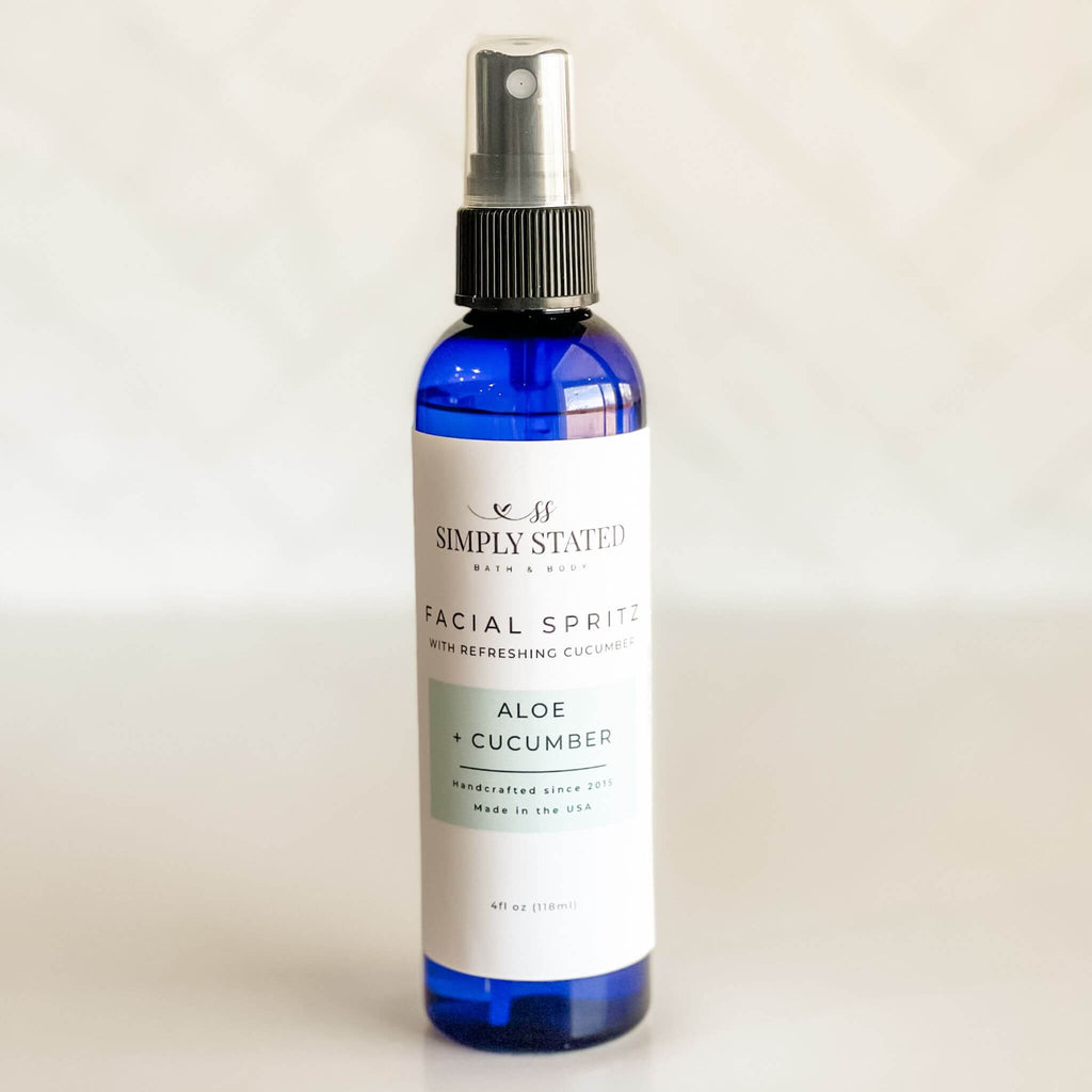 Close-up of Simply Stated Facial Spritz with Aloe + Cucumber, a hydrating mist in a sleek blue bottle, perfect for soothing and refreshing skin.