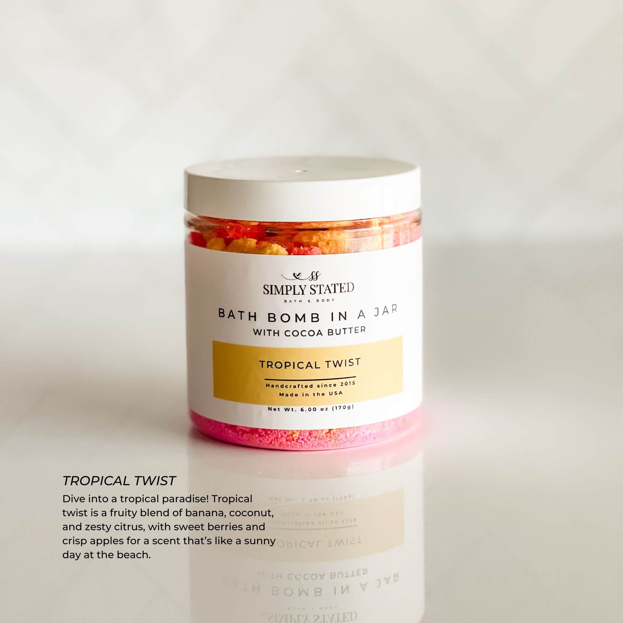 Kids Bath Bomb in a Jar – Tropical Twist scent, featuring a blend of banana, coconut, and apple for a refreshing bath treat.