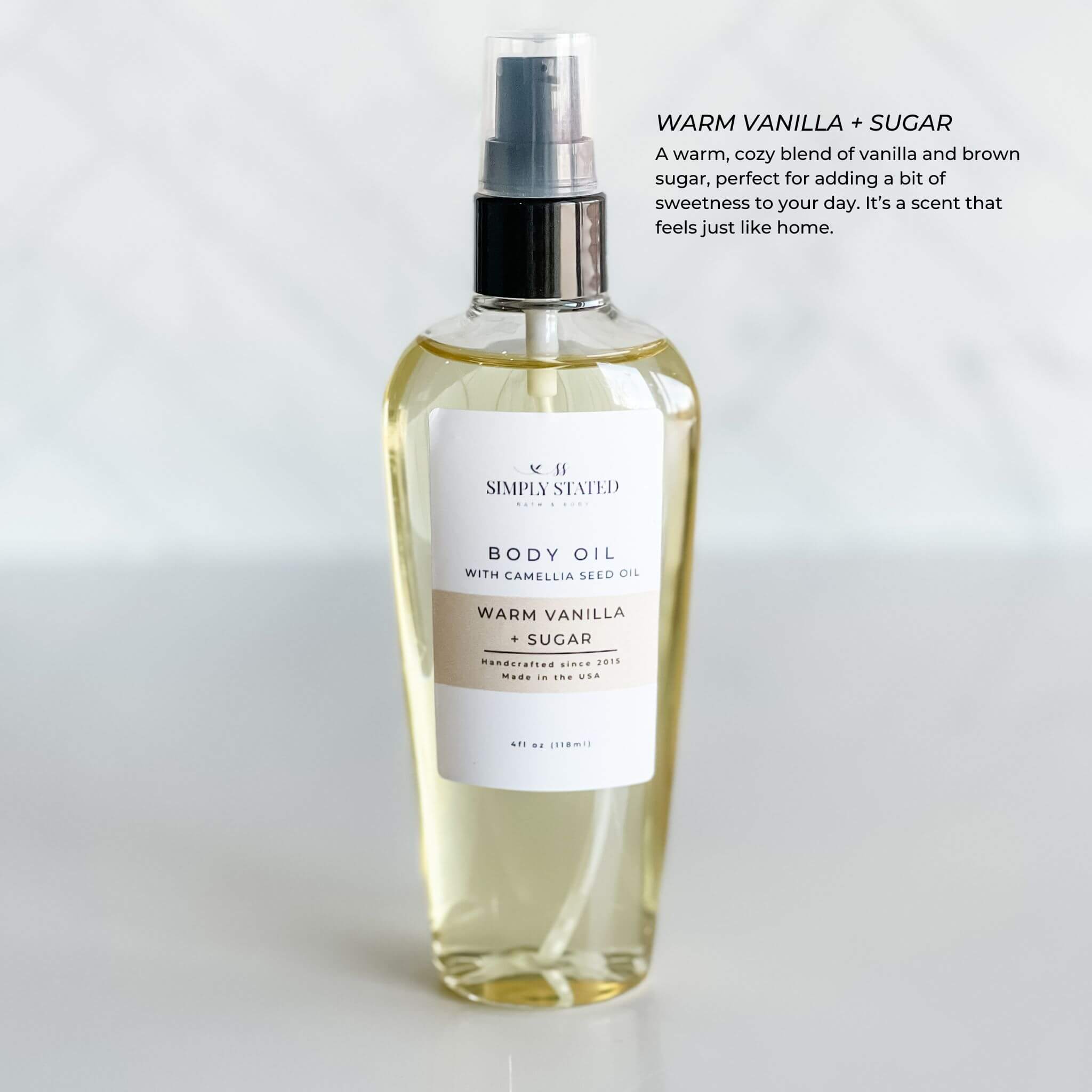 Simply Stated Bath & Body's Warm Vanilla + Sugar Body Oil in a 4oz bottle. Indulge in a cozy, sweet vanilla and brown sugar scent that nourishes your skin.