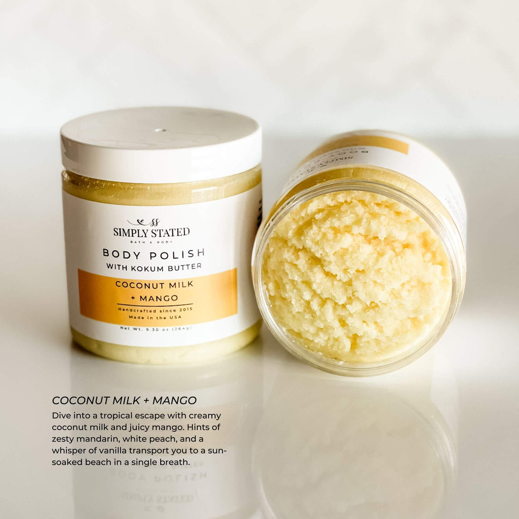 Simply Stated Body Polish in Coconut Milk + Mango scent, a creamy exfoliating scrub with kokum butter, offering hints of mandarin, white peach, and vanilla for a tropical escape. 9.3 oz jar with updated label design.