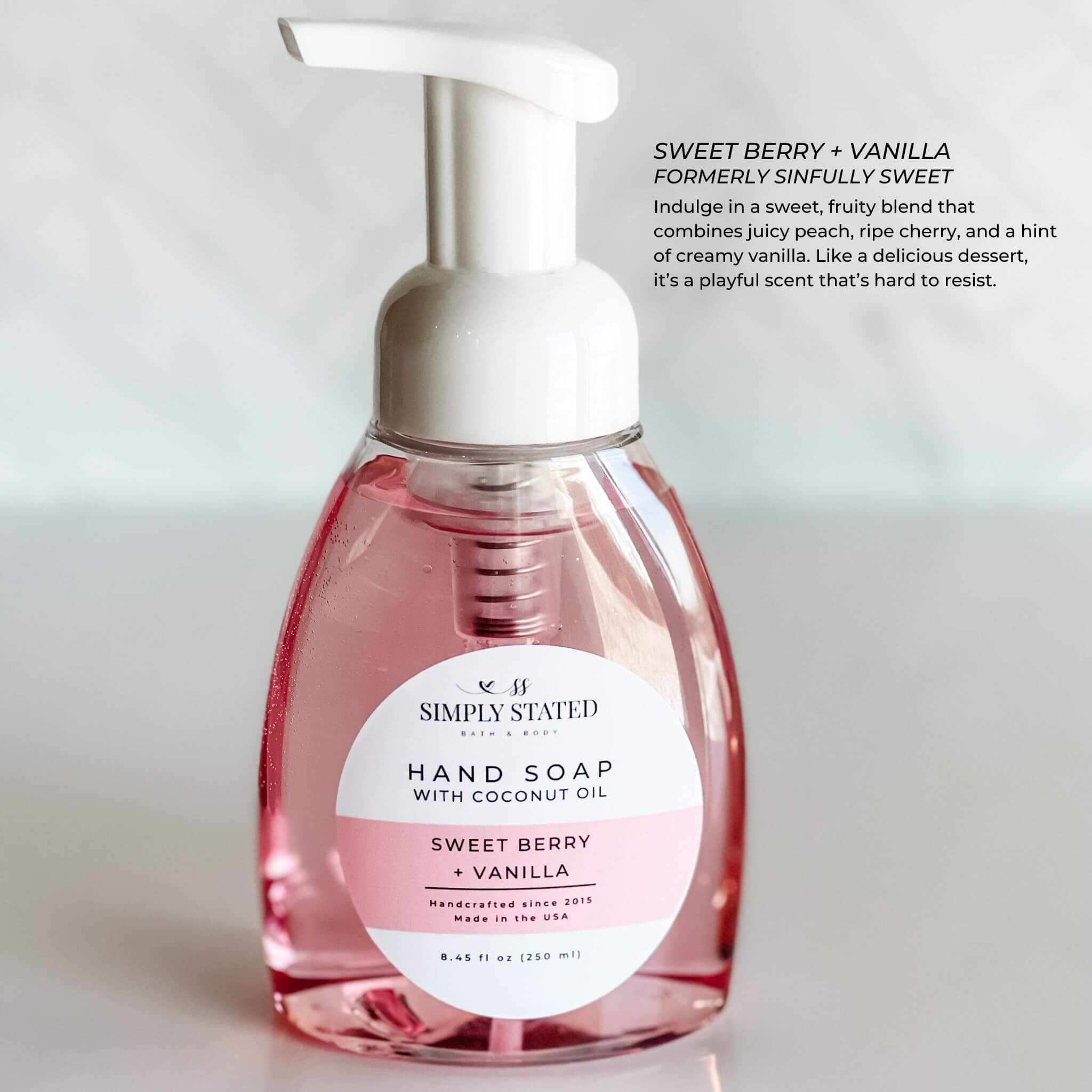 Signature Sweet Berry + Vanilla Hand Soap by Simply Stated Bath & Body, featuring a vibrant pink 8oz pump bottle. Indulge in the sweet and fruity scent for a joyful hand wash.