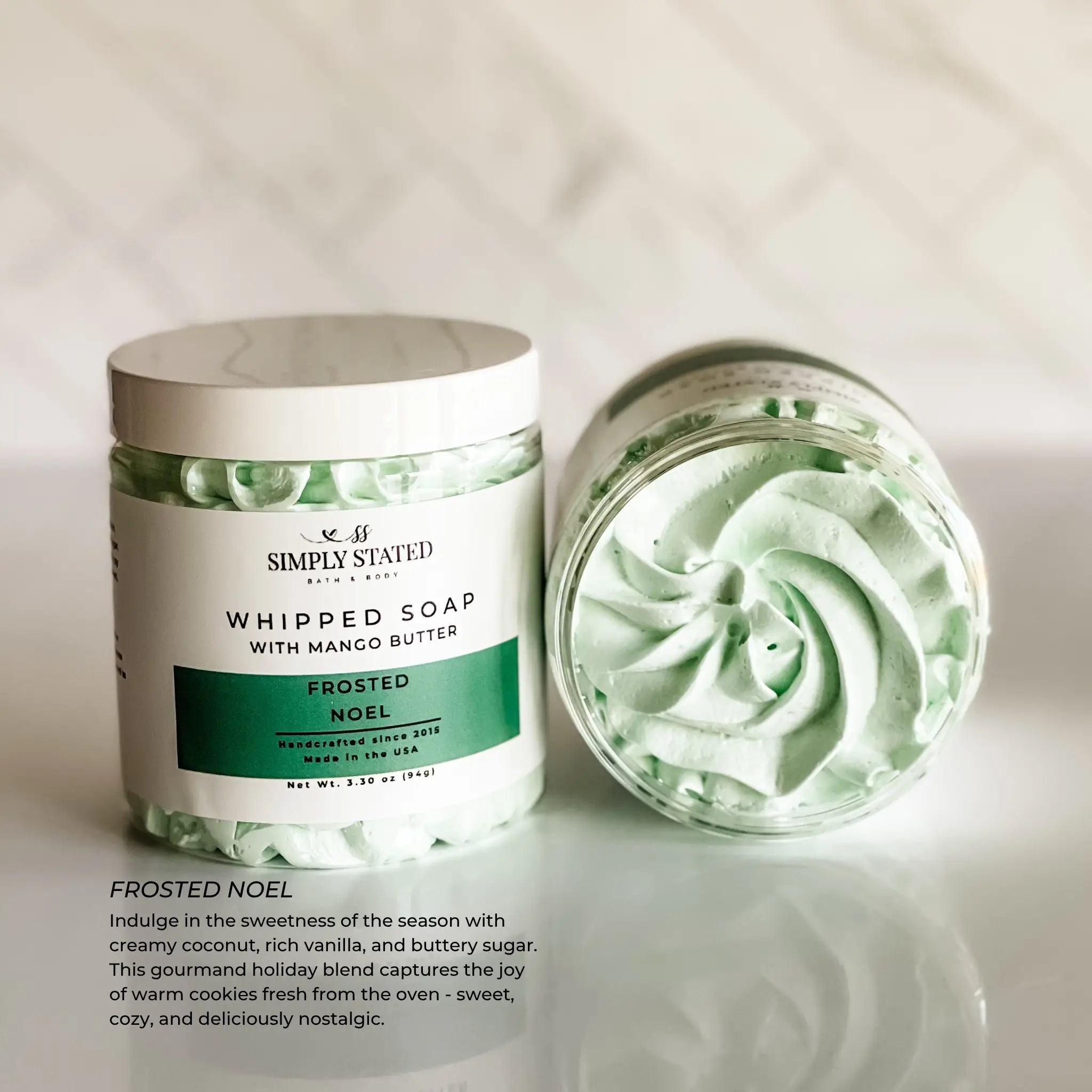 Whipped soap with mango butter in a jar labeled 'Simply Stated' on a light background